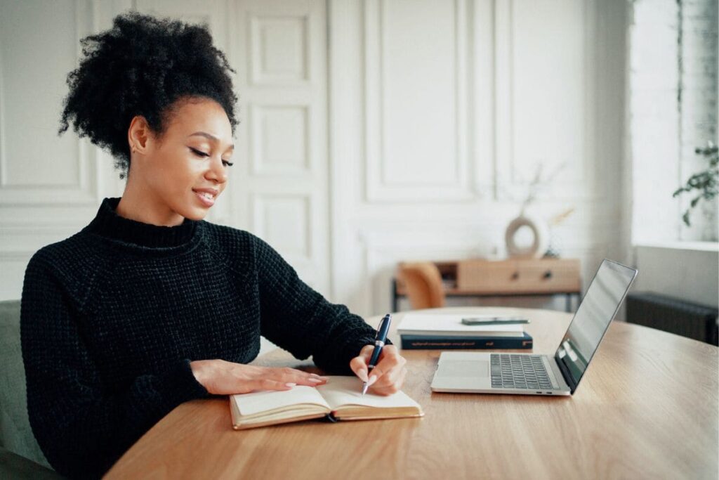 A woman entrepreneur working from home on her side business.