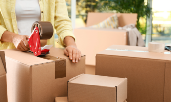 Woman packing boxes to to ship off